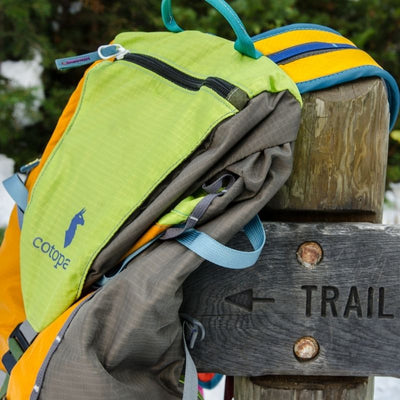 tarak backpack on trail sign