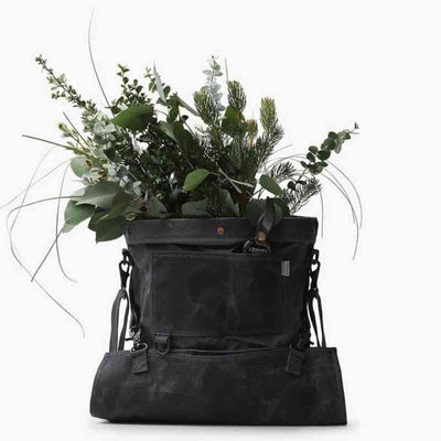 flowers in a grey gathering bag